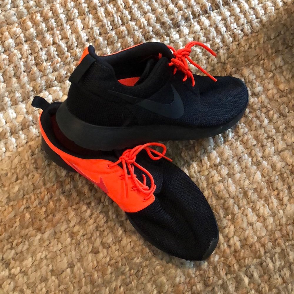 Black and orange Nike athletic shoes
